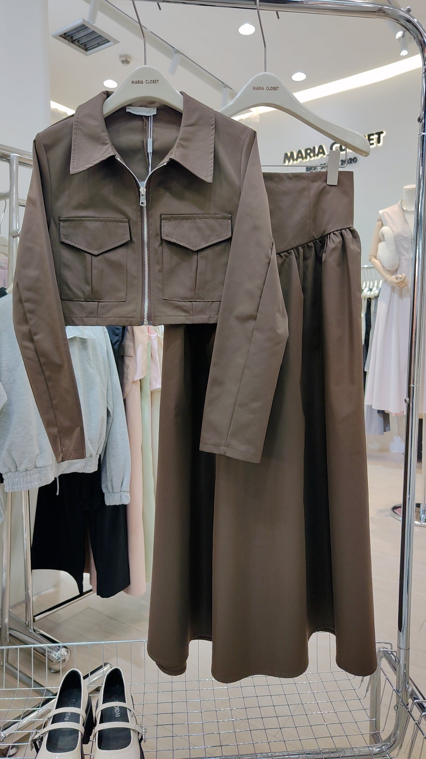 The "Classic Vest" Co-ord Set in premium fabric with zip-front vest and long matching skirt on display.