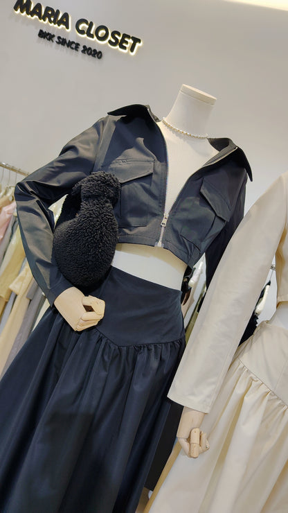 The "Classic Vest" Co-ord Set featuring a cropped zip-front vest and matching elegant long skirt in black fabric.