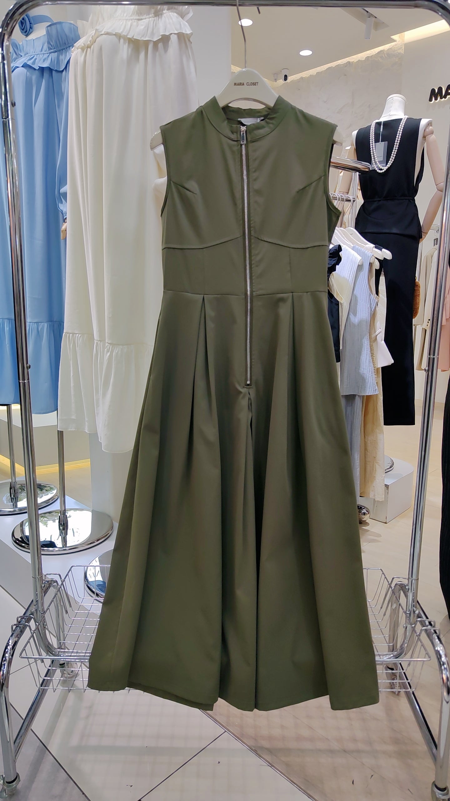 The "Urban Zip-Front" Maxi Dress in olive green with sleeveless design and front zipper detail.