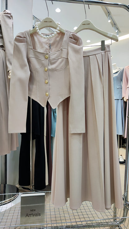 The "Flowy Tweed" Co-ord Set featuring a fitted long-sleeve top and flowing high-waist skirt in soft beige.